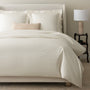 alesandra percale knife edge duvet cover in the color ivory  features a button closure and ribbon ties inside each corner #color_ivory