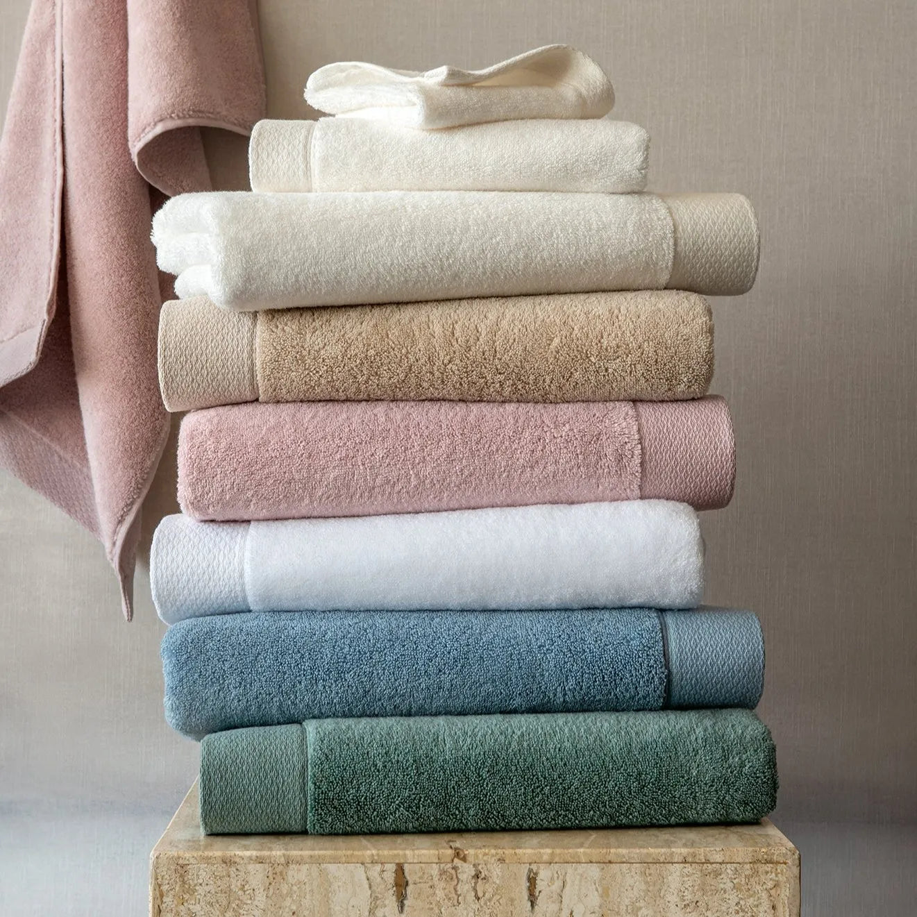 stack of cosima bath towels in every color